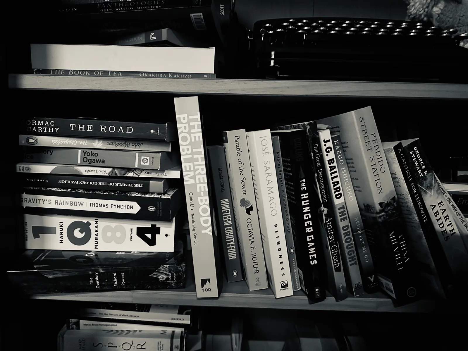 A stack of books from diverse literary traditions for cross-cultural reading